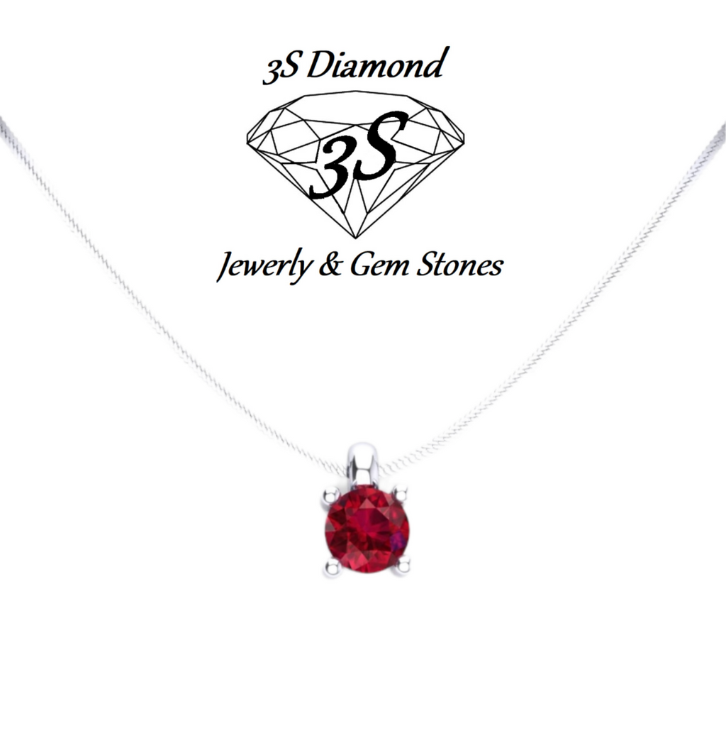 ciondolo punto  luce in oro bianco 18k e rubino naturale 0,50 ct