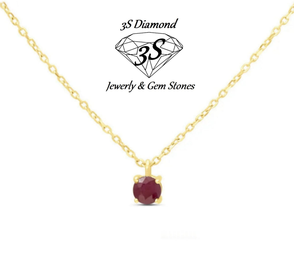 ciondolo punto  luce in oro bianco 18k e rubino naturale 0,50 ct