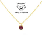 ciondolo punto  luce in oro bianco 18k e rubino naturale 0,50 ct