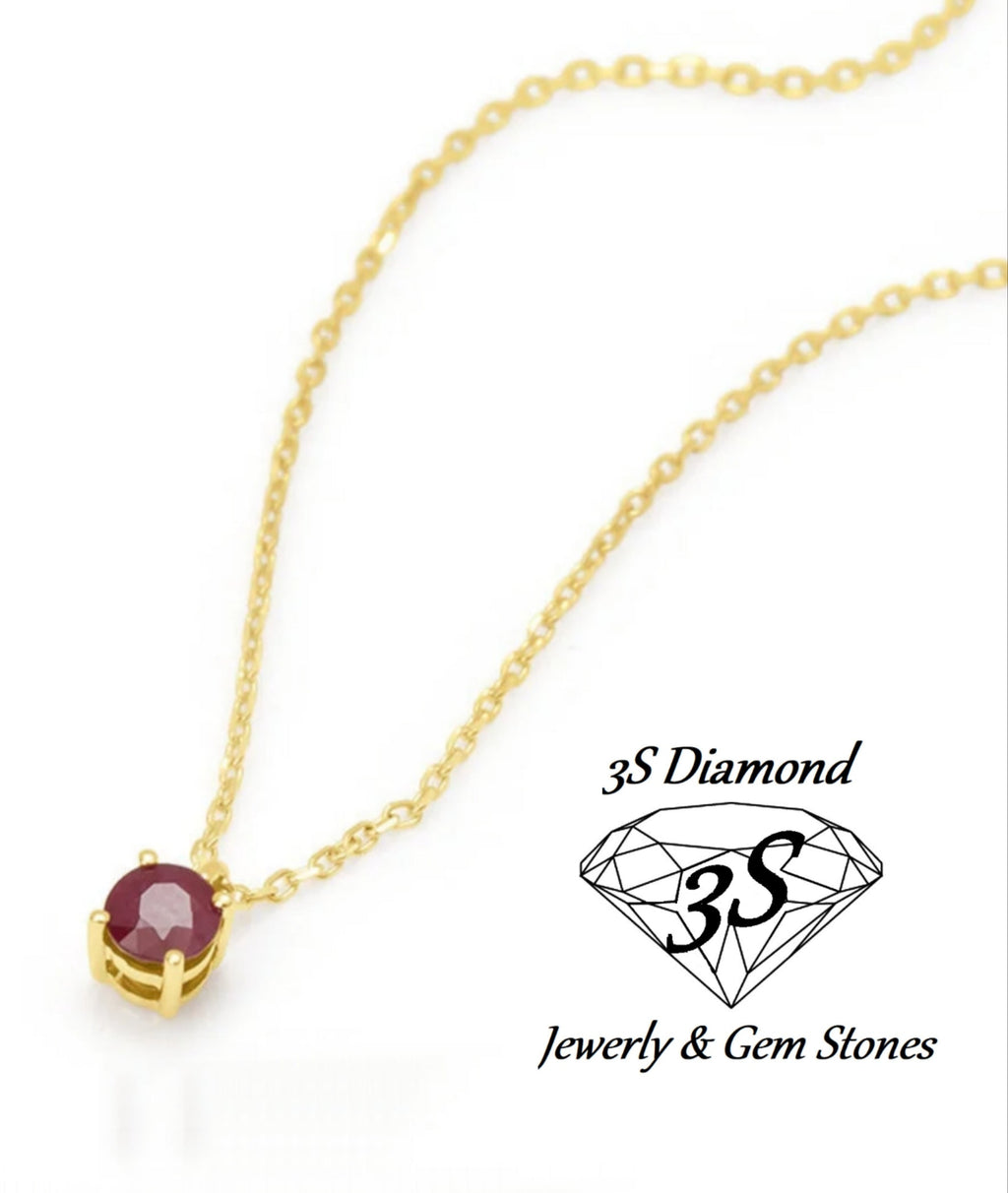 ciondolo punto  luce in oro bianco 18k e rubino naturale 0,50 ct