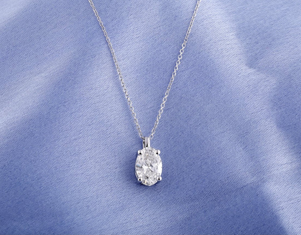 Collana punto luce in oro e diamante naturale ovale 0.20ct